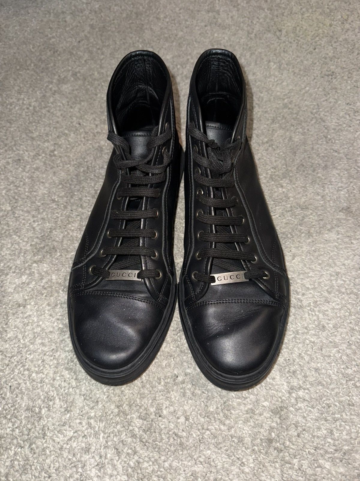 Black leather Gucci high top trainers