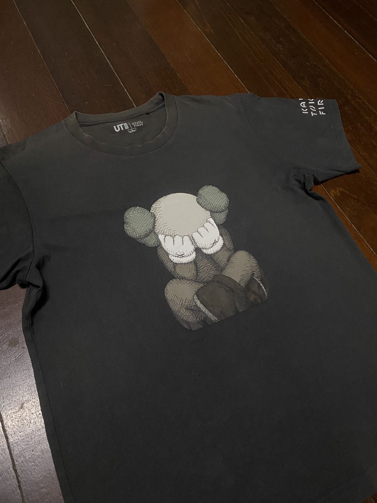 Hypebeast × Kaws FIRE 🔥🔥 UNIQLO X KAWS TOKYO FIRST SAD DESIGN Size US L / EU 52-54 / 3 - 7 Thumbnail