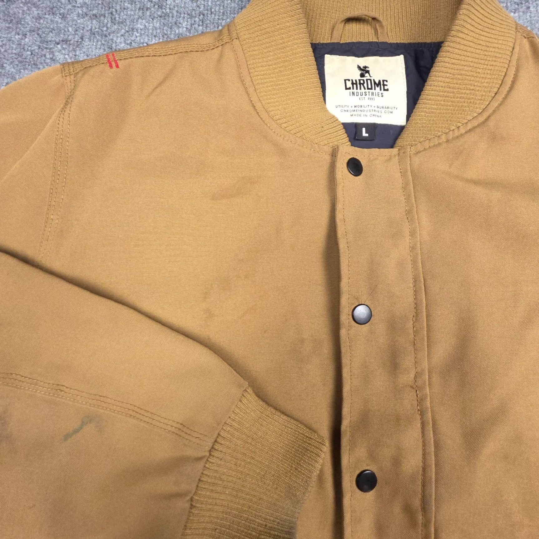 Industrie **Chrome Industries Large Men's Beige Stained Bomber Jacket** User: **Chrome Industries Men's Large Beige Stained Bomber Jacket** Size US L / EU 52-54 / 3 - 6 Thumbnail