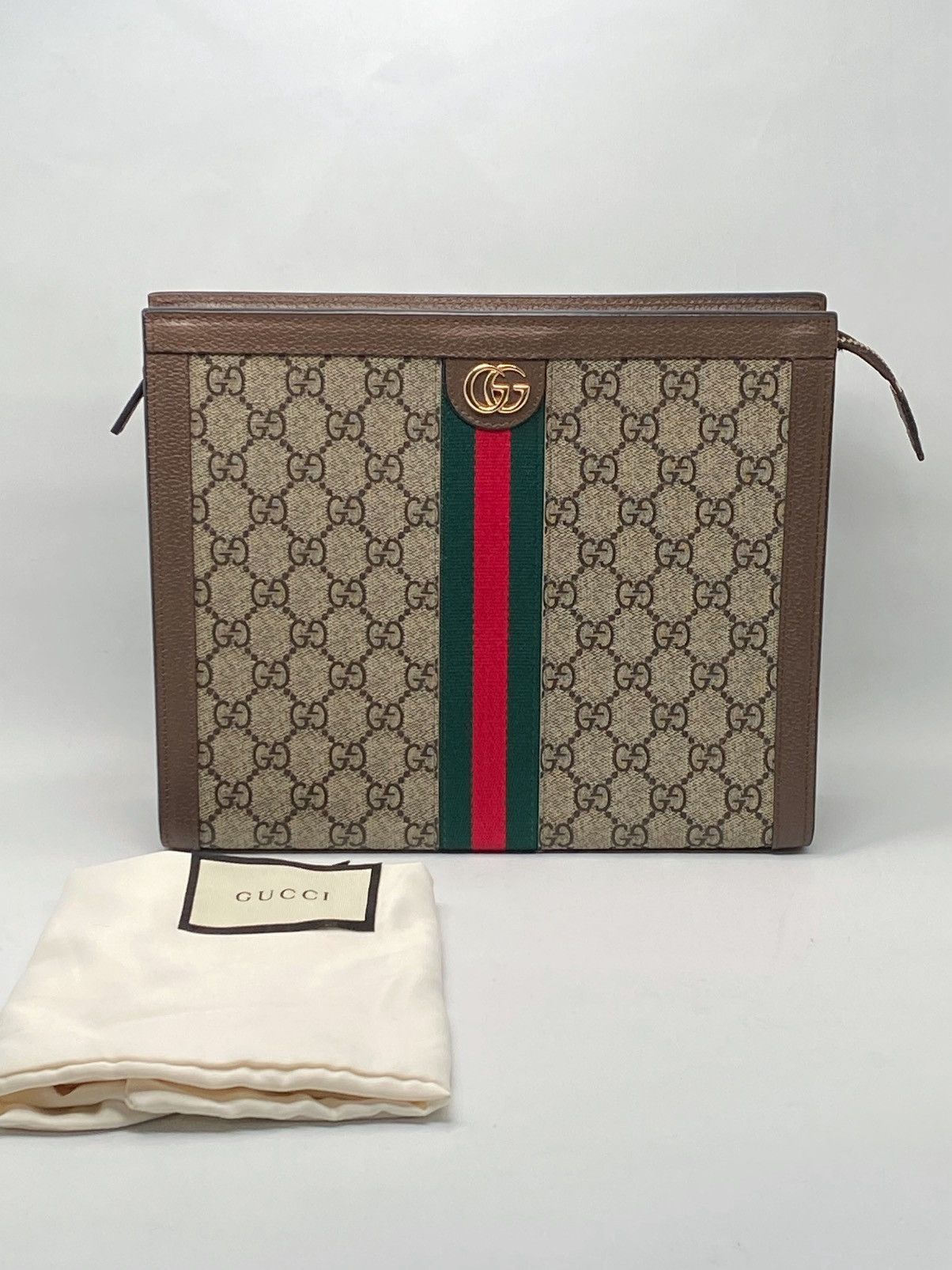 Gucci GG Supreme Fabric clutch with iconic Web Band