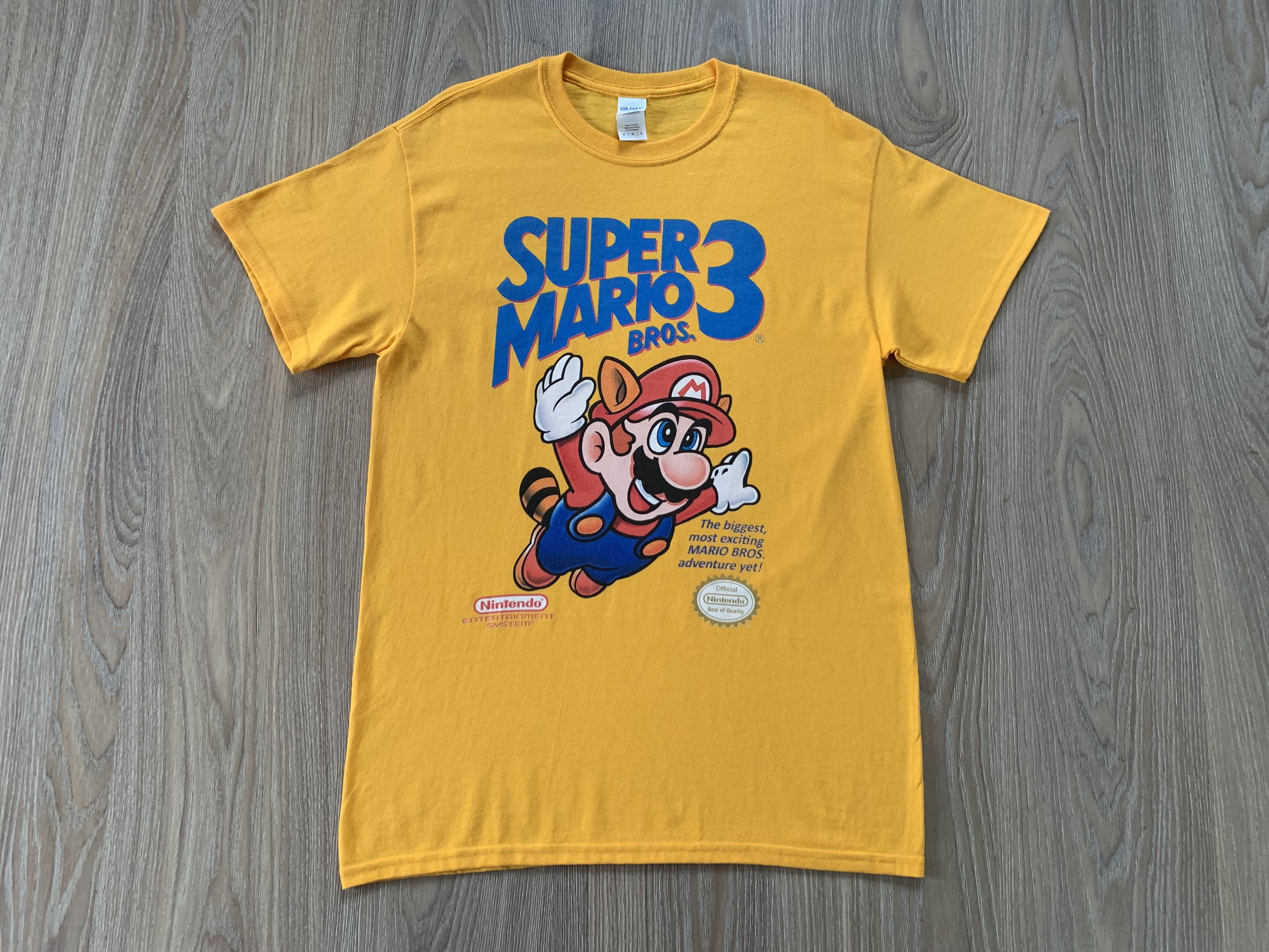 image of Gildan x Nintendo Vintage Super Mario Bros 3 T Shirt in Yellow, Men's (Size Medium)