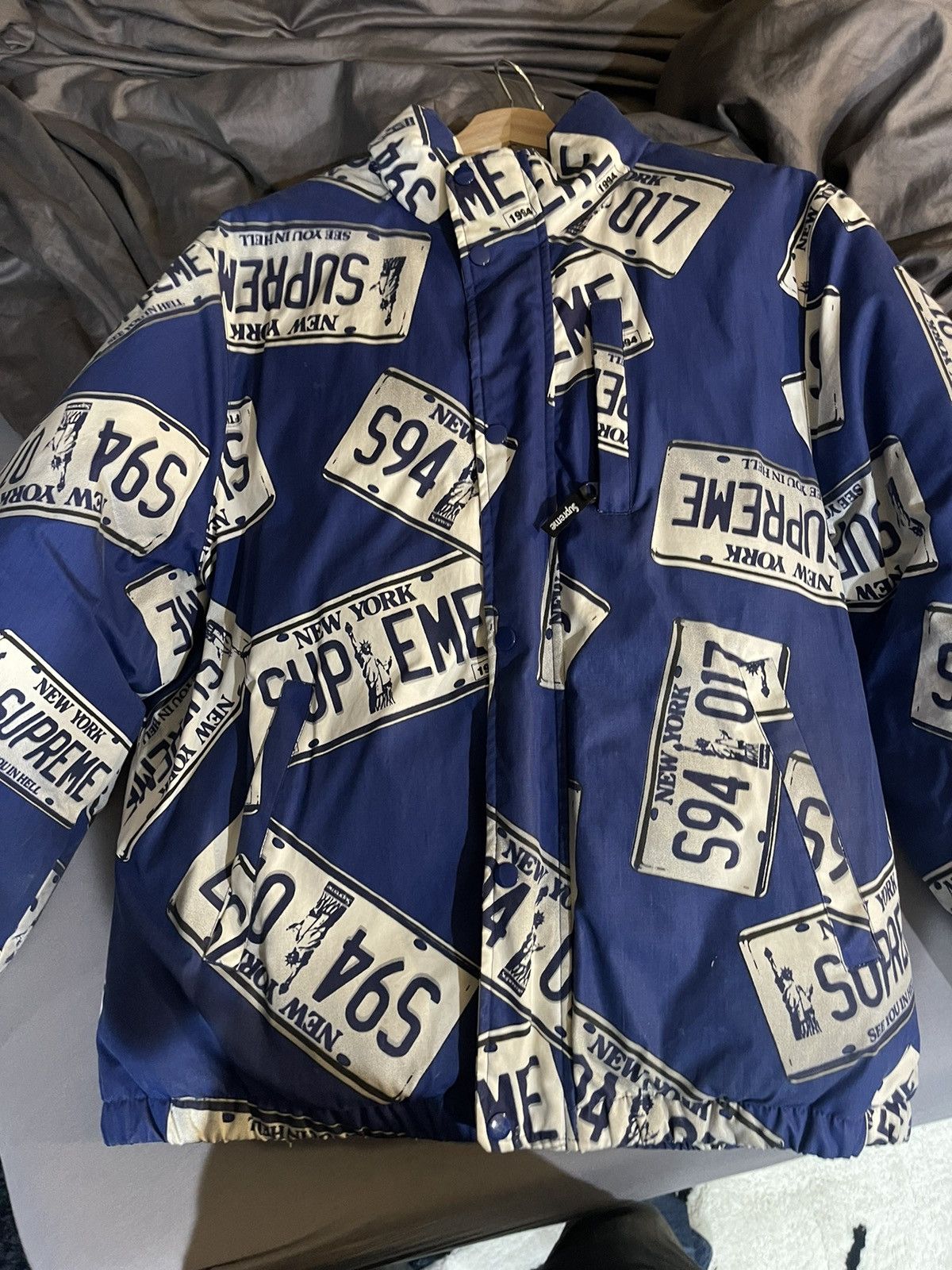 Supreme license plate puffy jacket | Grailed