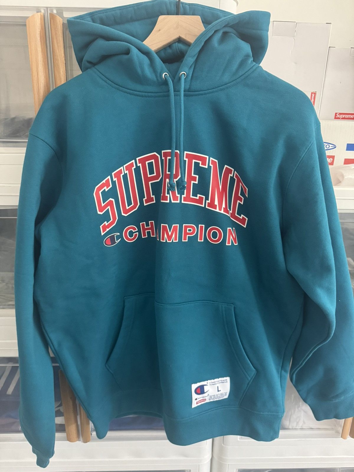 Champion x supreme blue teal hotsell hoodie