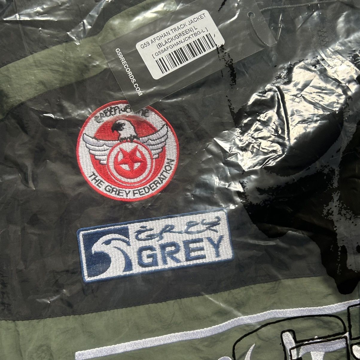 Fuck The Population × G59 Records G*59 AFGHAN TRACK JACKET PASHTO FARSi SHELL WiNDBREAKER Size US L / EU 52-54 / 3 - 4 Thumbnail