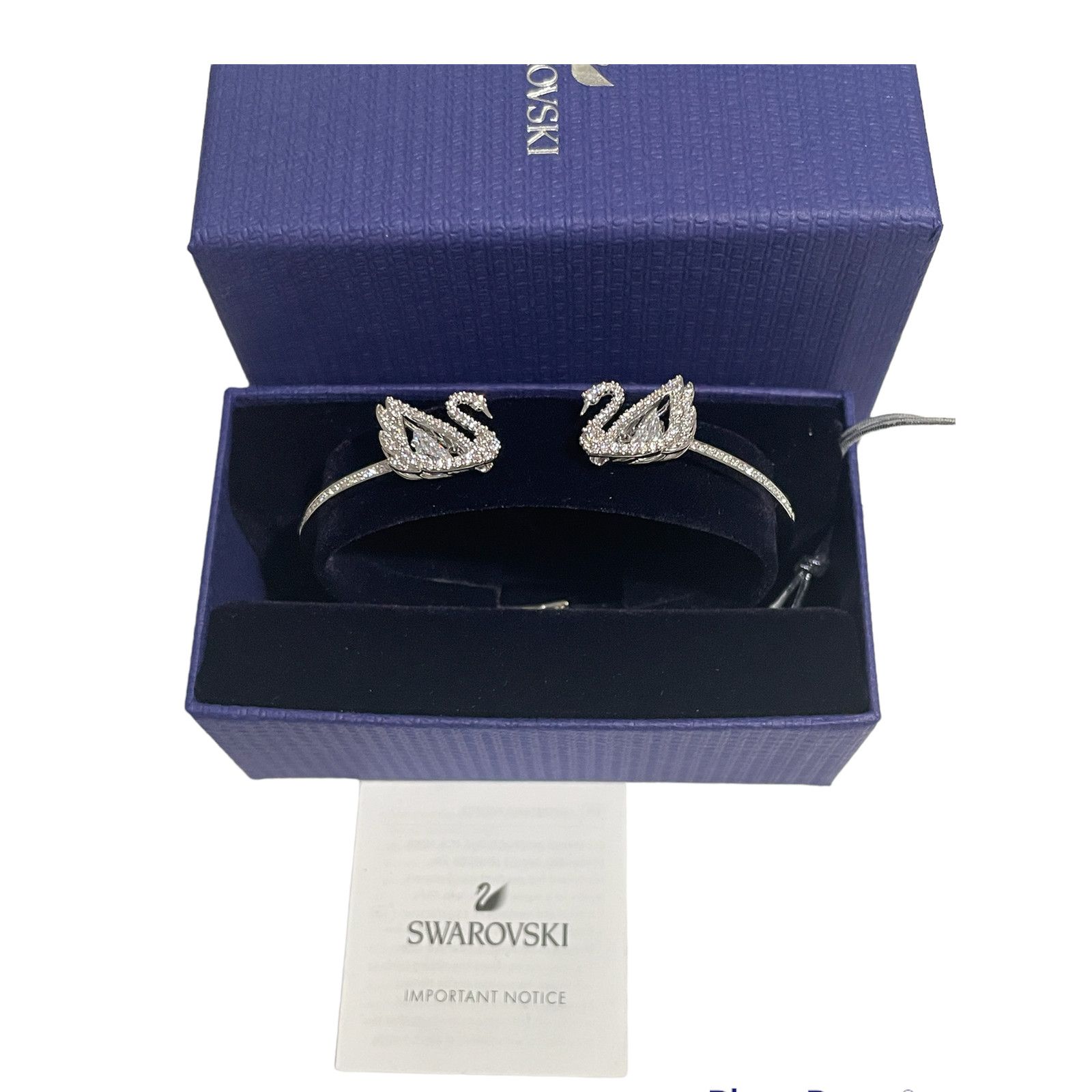 image of Swarovski Dancing Swan Bangle, White, Rhodium Plated Size M in Silver, Women's