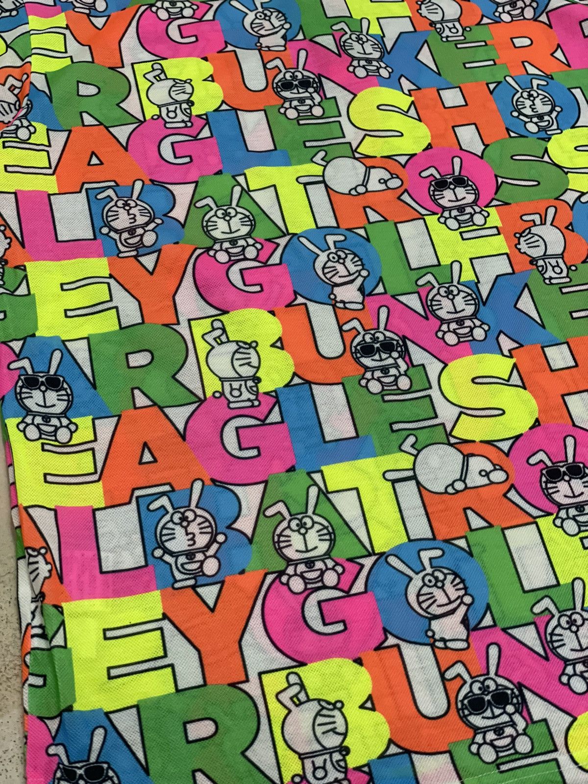 Anime × Japanese Brand × Psycho Bunny Jack Bunny Doraemon Polo Fullprint Wording Colorful Size US L / EU 52-54 / 3 - 12 Thumbnail
