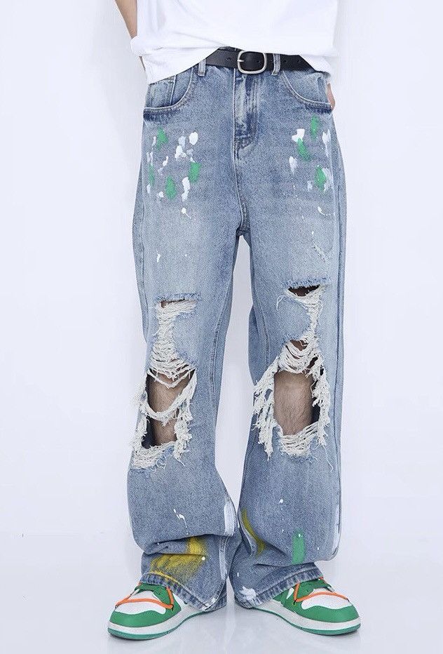 Fashion grunge distressed ripped graffiti jeans