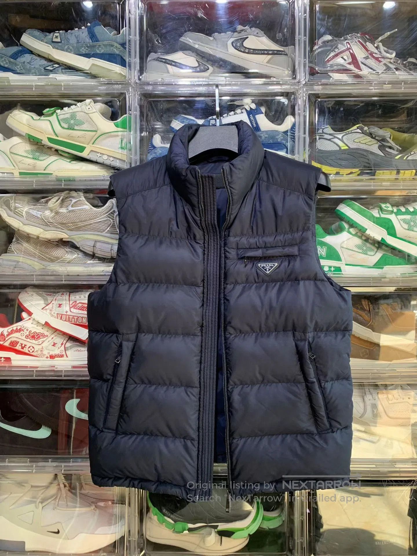 prada down vest in deep blue color.