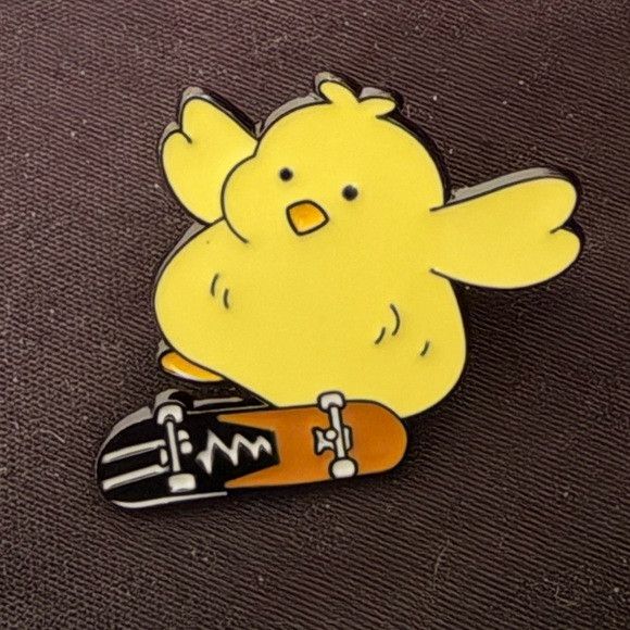 Other Yellow Duck Skateboarding Chick Doing a Kick Flip Enamel Pin Size ONE SIZE - 1 Thumbnail