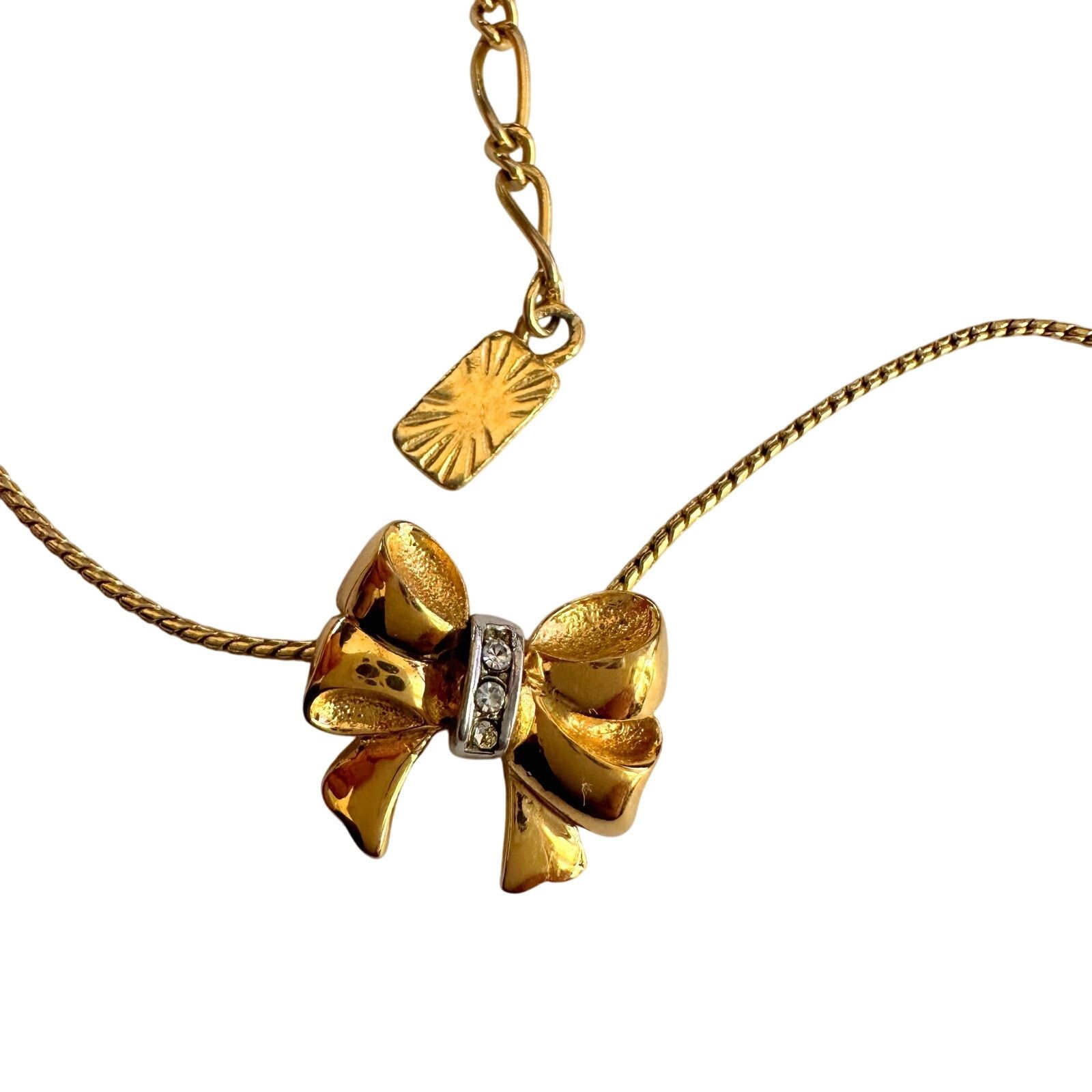Yves Saint Laurent Yves Saint Laurent Gold and Rhinestone Bow Necklace Size ONE SIZE - 11 Thumbnail