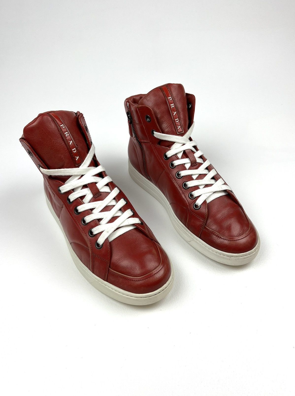 image of Italian Designers Prada Hi Top Leather Sneakers With Imitation Scuff Marks in Red, Men's (Size 10)