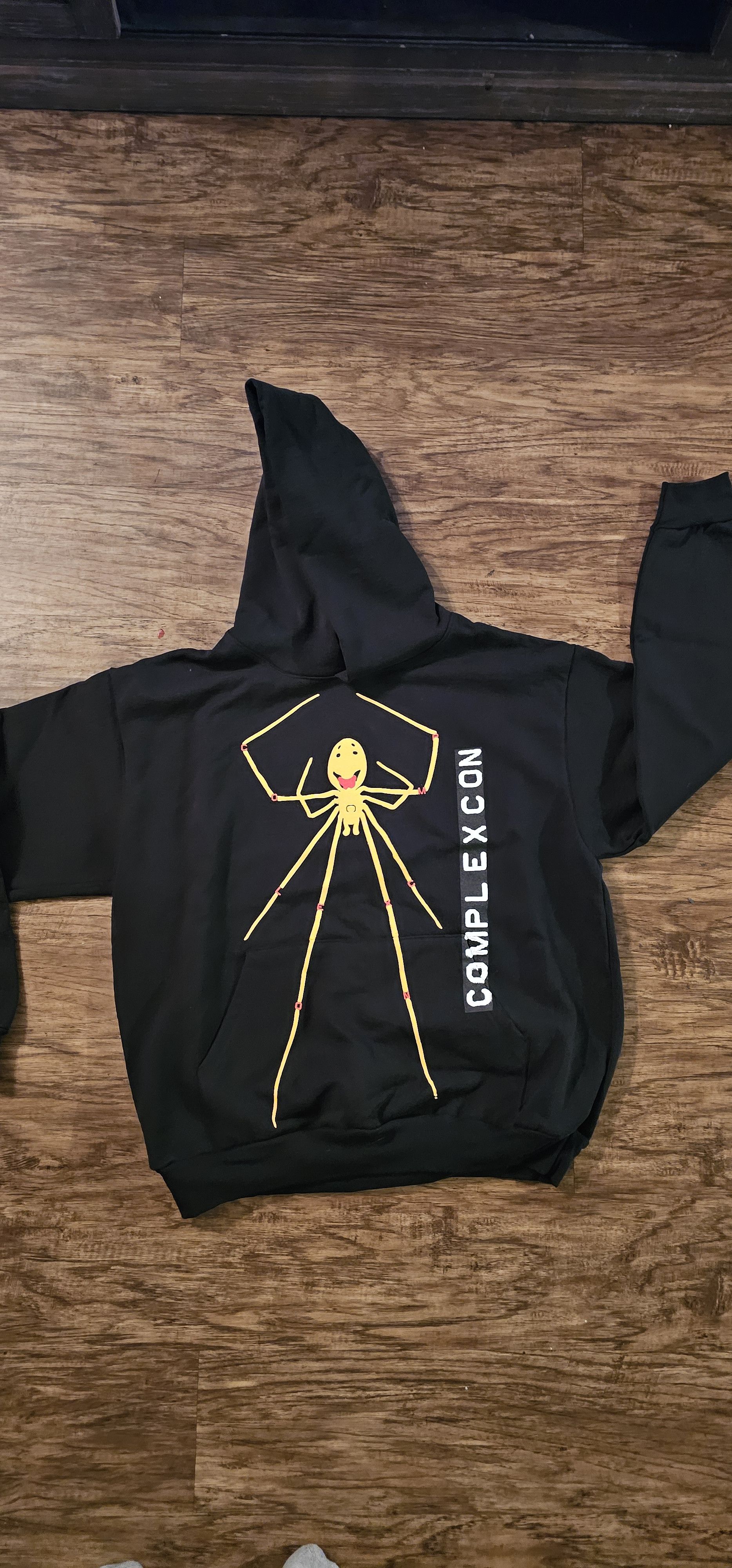 image of Cactus Plant Flea Market x Complexcon Smiling Spider Legs Hoodie in Black, Men's (Size XL)