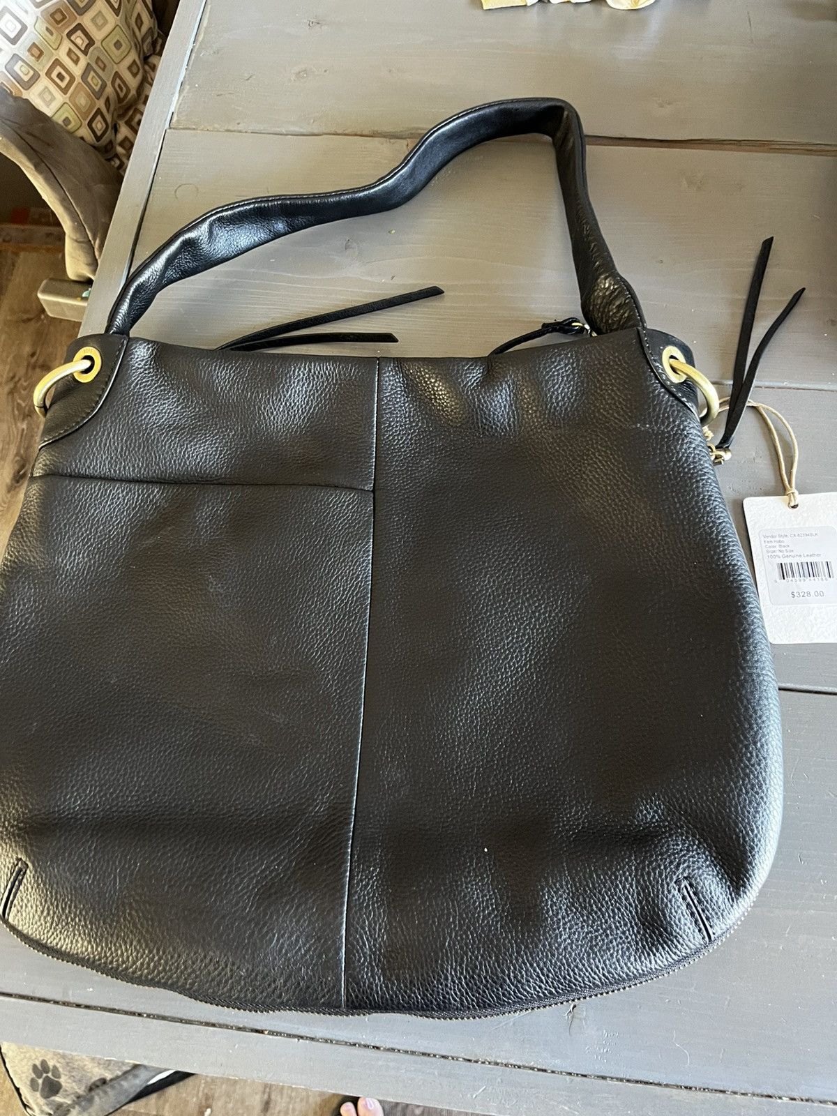 HOBO brand genuine leather shoulder bag in pebbled leather.