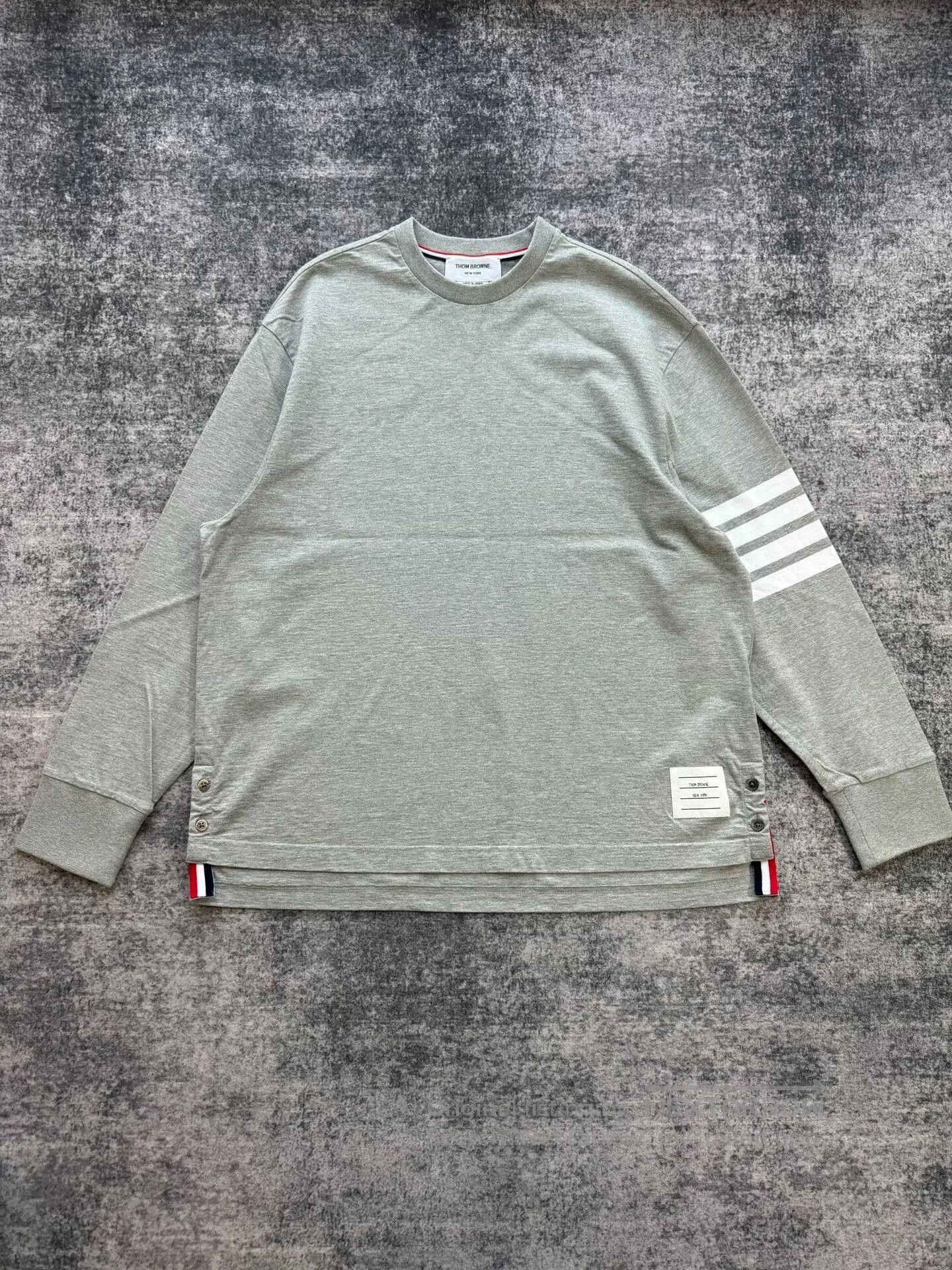 thom browne gray sweatshirt with logo detail.