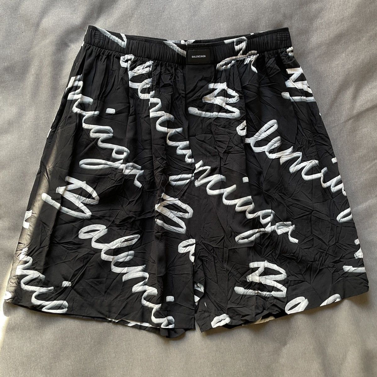 image of Balenciaga Scribble Logo Shorts in Black, Men's (Size 34)