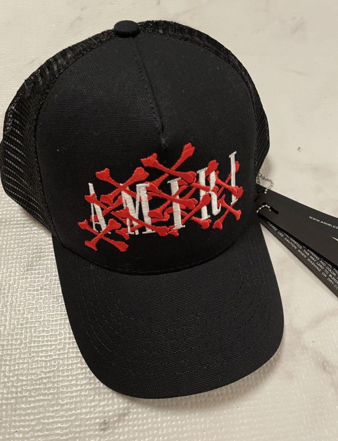 image of Amiri Tokyo Xo Bones Trucker Hat Cap in Black, Men's