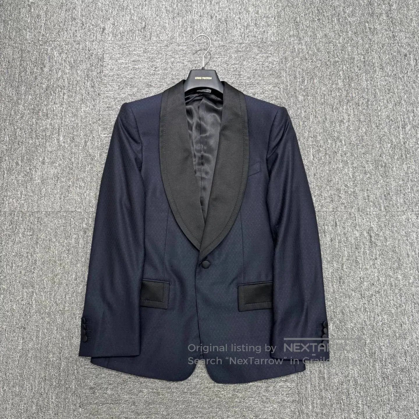 dark patterned tailored suit jacket.