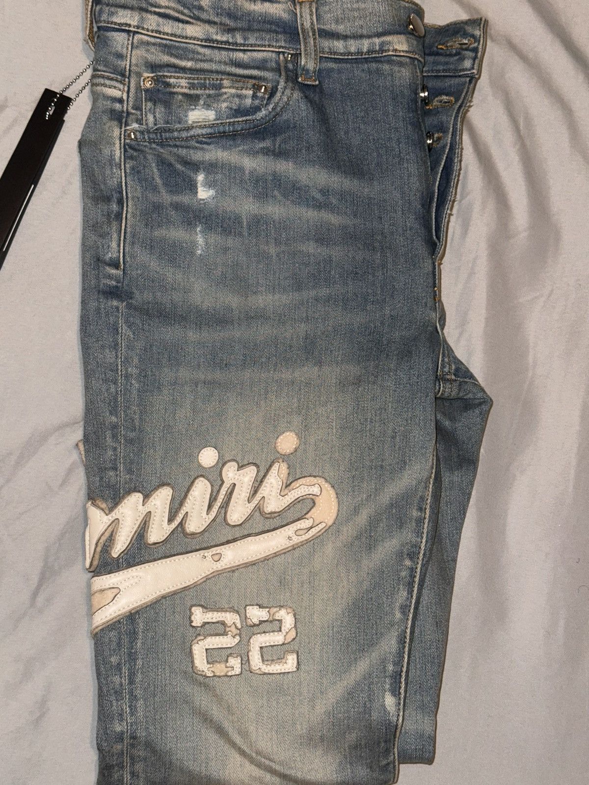 image of Amiri Varsity Applique Logo Jeans in Blue, Men's (Size 31)