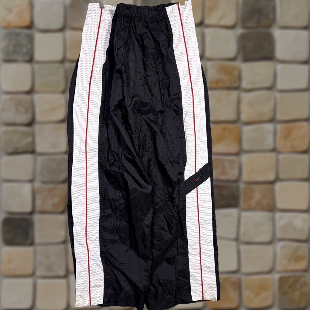 Nike Keywords: "90s Track Pants," "Vintage Nike," "2XL," "Warmup Sweatpant," "Baggy," "Tearaway," "Black" directly address the item’S style and size Size US 39 - 1 Thumbnail