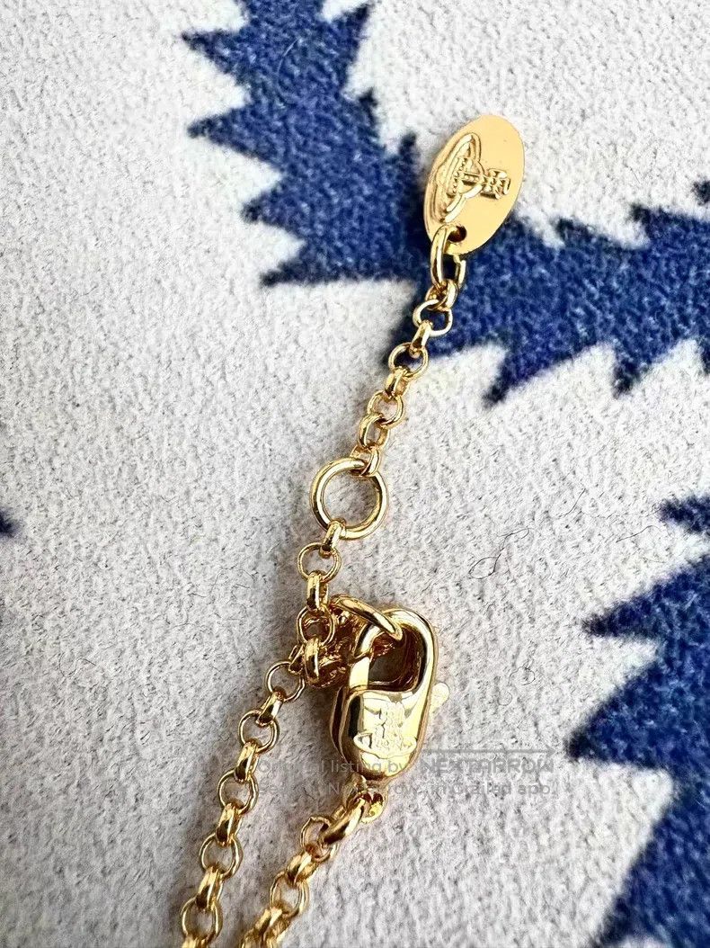 Vivienne Westwood Golden diamond-patterned Orb Saturn plan