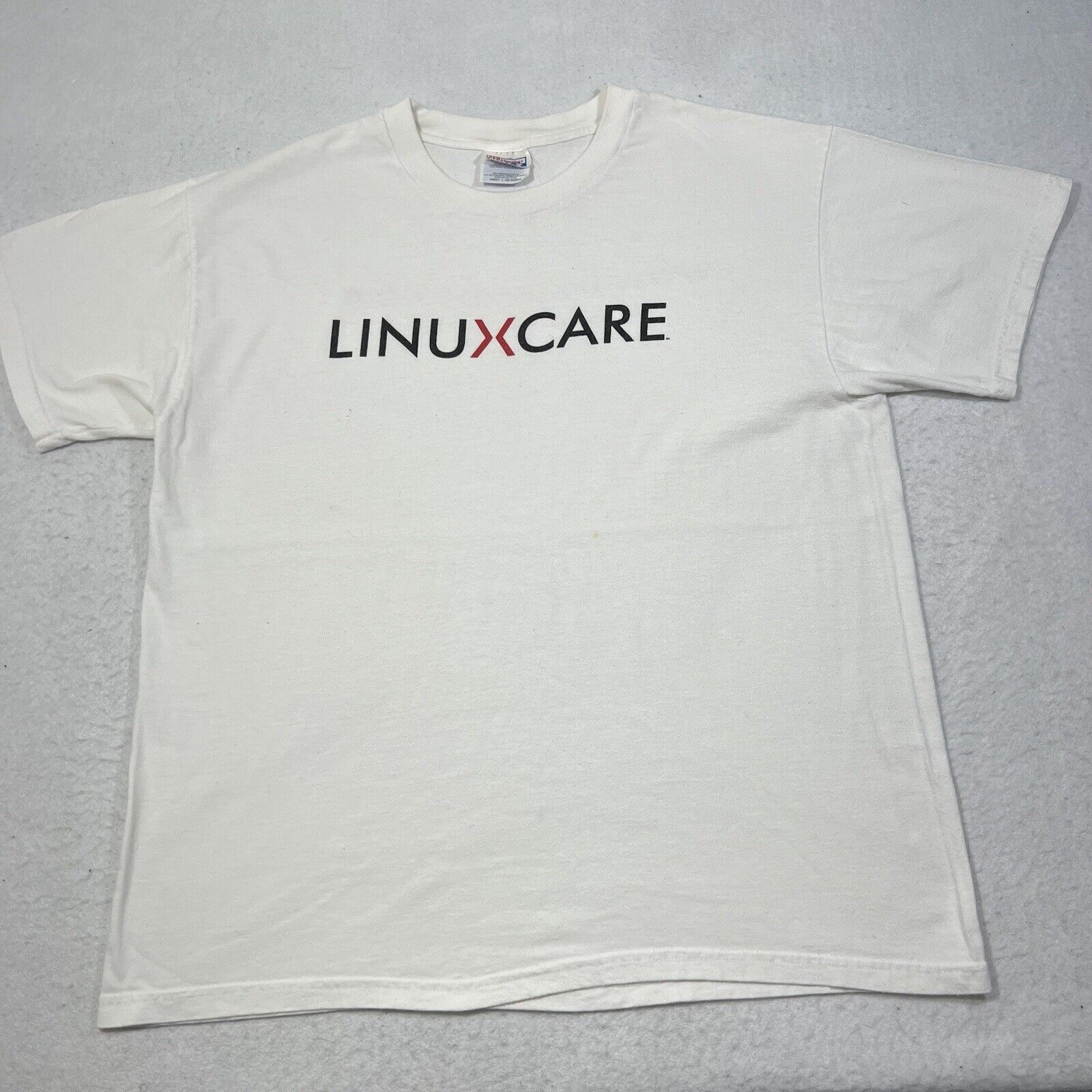 Hanes Vintage Linuxcare White Tee Graphic T Shirt Hanes Size US L / EU 52-54 / 3 - 1 Thumbnail