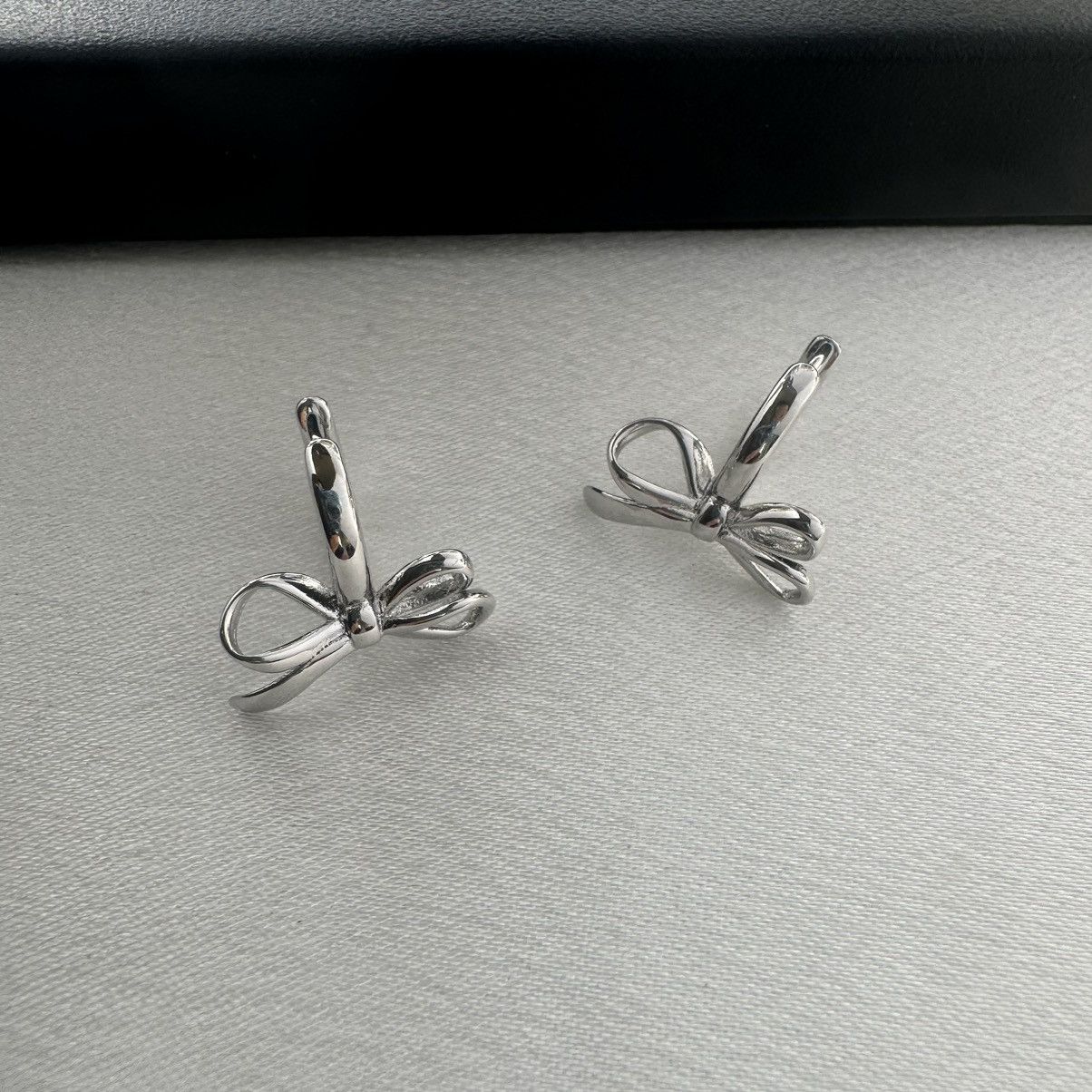 Designer Huggie Bow Silver Hoop Earrings for Women Size ONE SIZE - 3 Thumbnail