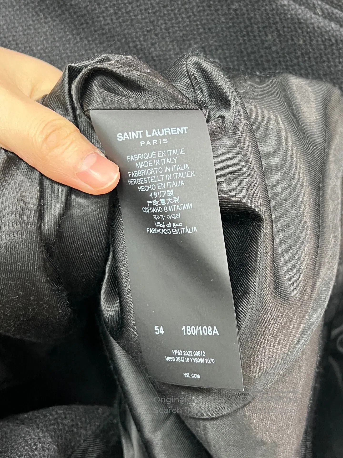black and white baseball jacket from Saint Laurent.