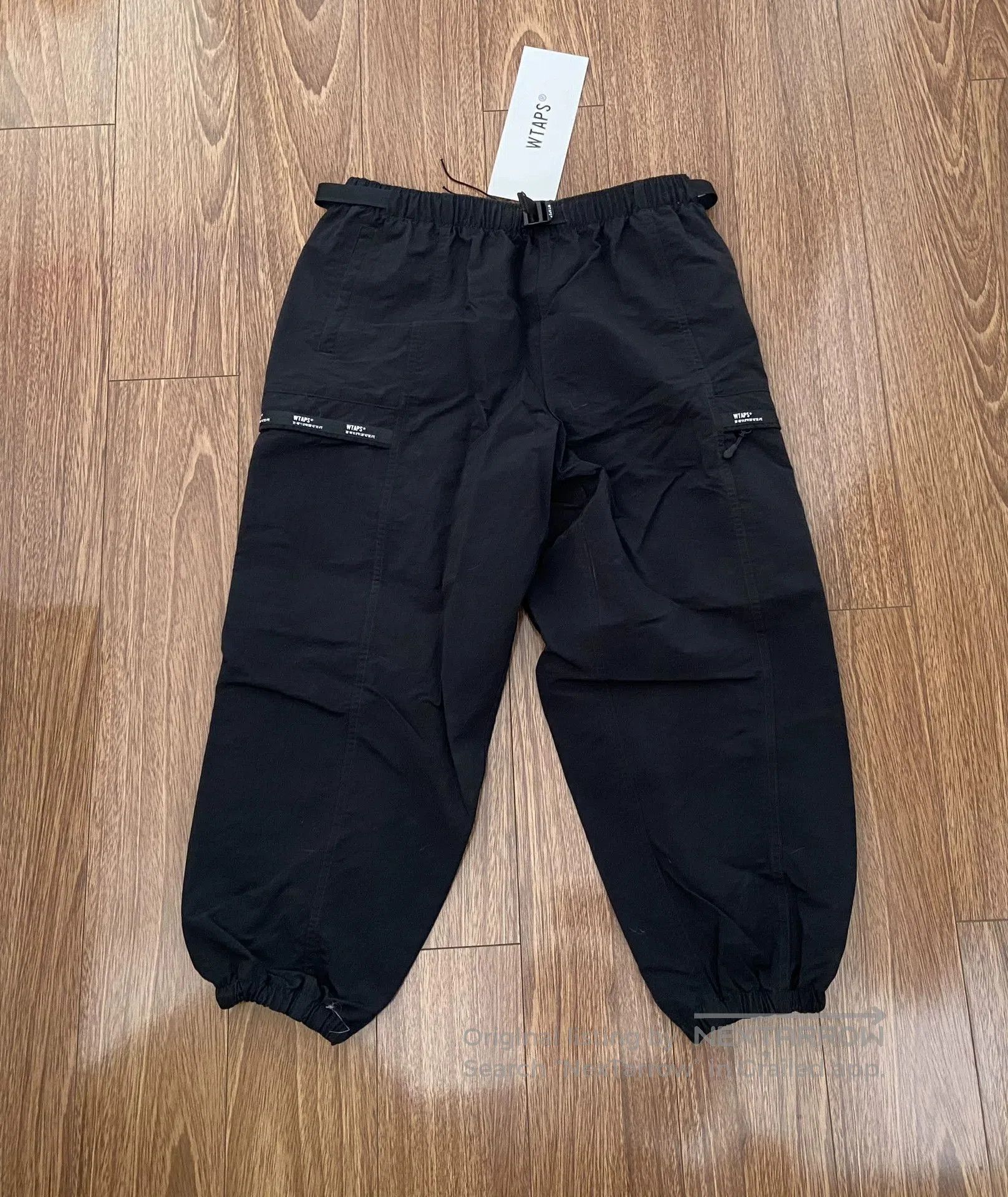 wtaps nylon track trousers in black.