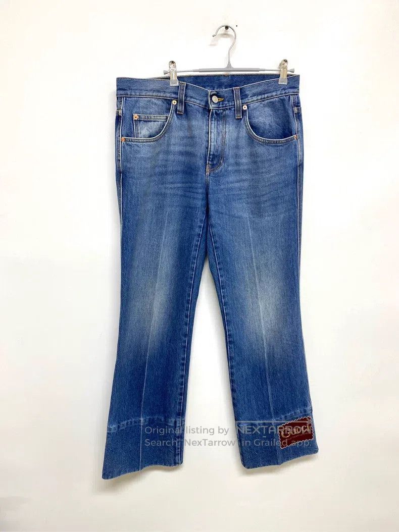 Gucci Label washed denim flared trousers