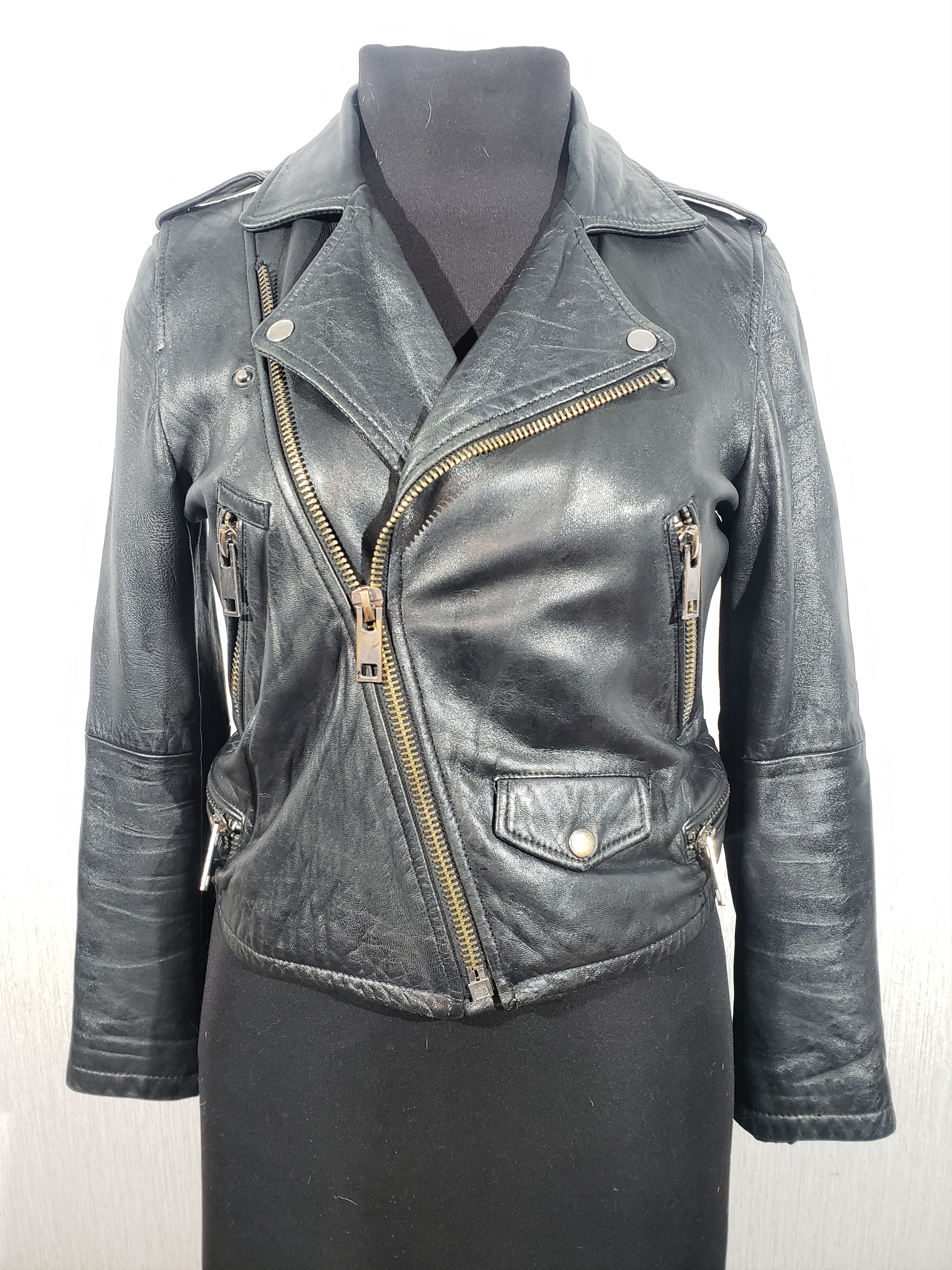 Cute women's leather jacket with a metal zipper.