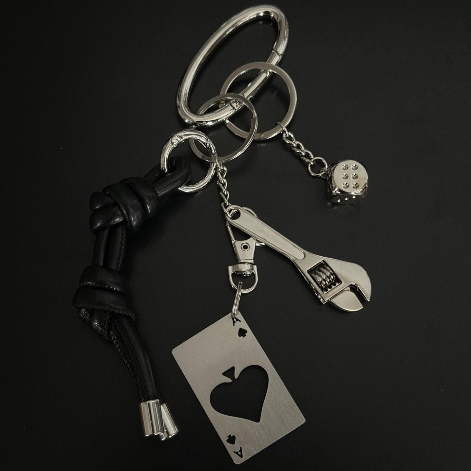 Jewelry Black Leather Knot Keychain with Metal Wrench & Dice Charms Size ONE SIZE - 1 Thumbnail