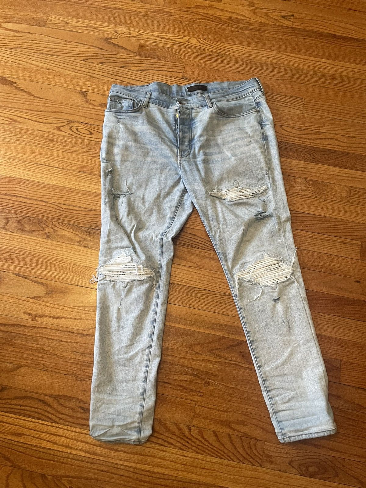 Amiri Light washed blue amiri jeans mx1 with white bandana patches ...