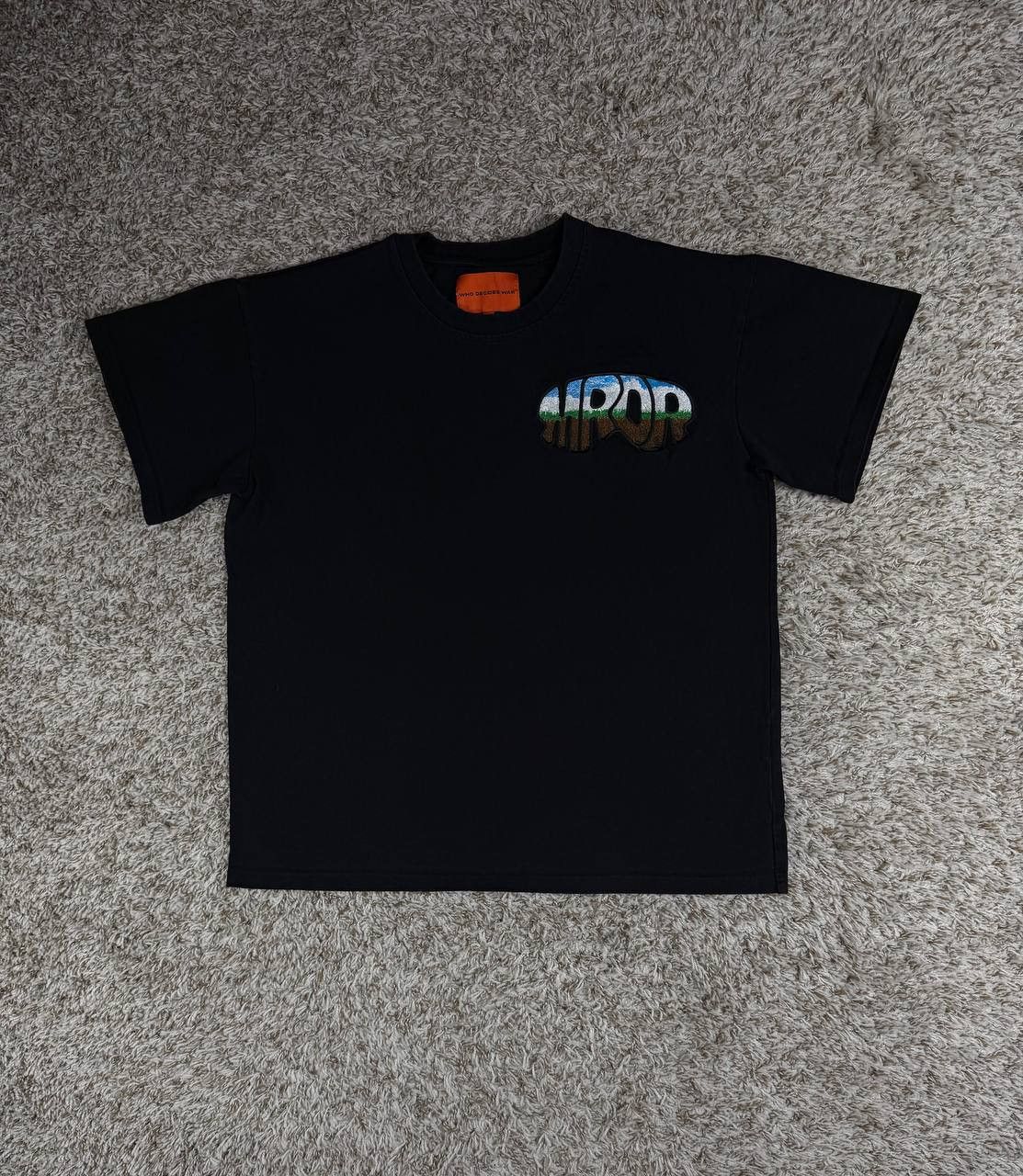 Who Decides War Embroidered MRDR Black T-Shirt