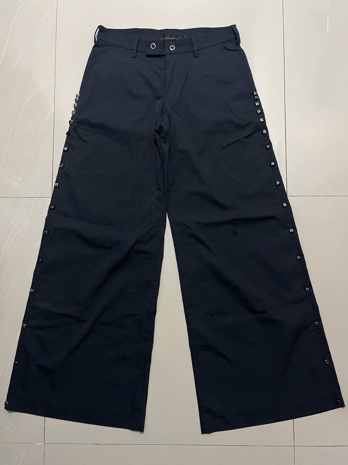Undercover SS2006 UNDERCOVER “T” STUDDED WIDE FLARED PANTS Size US 30 / EU 46 - 1 Thumbnail