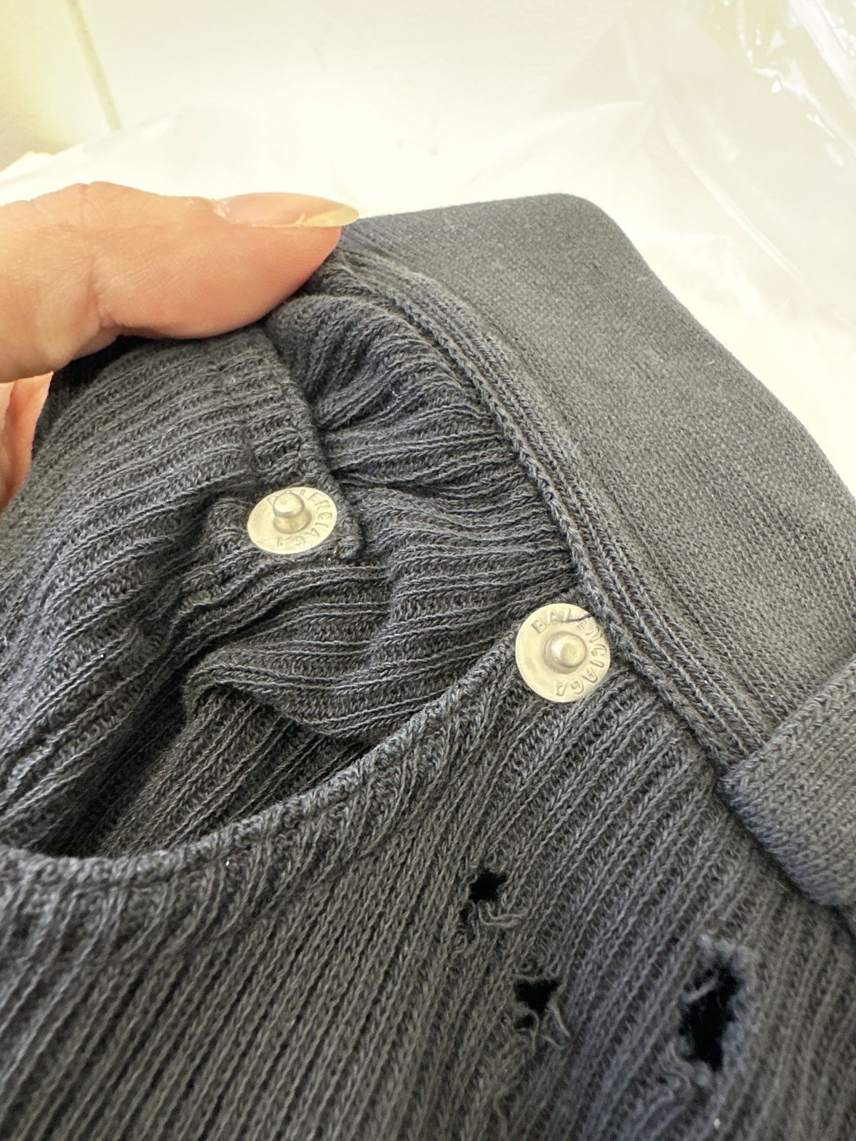 Distressed-effect trousers