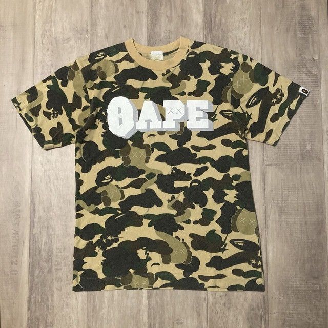 Bape × Kaws BAPE × Kaws Bendy 1st Camo Yellow T-shirt a bathing ape NIGO Size US S / EU 44-46 / 1 - 2 Thumbnail