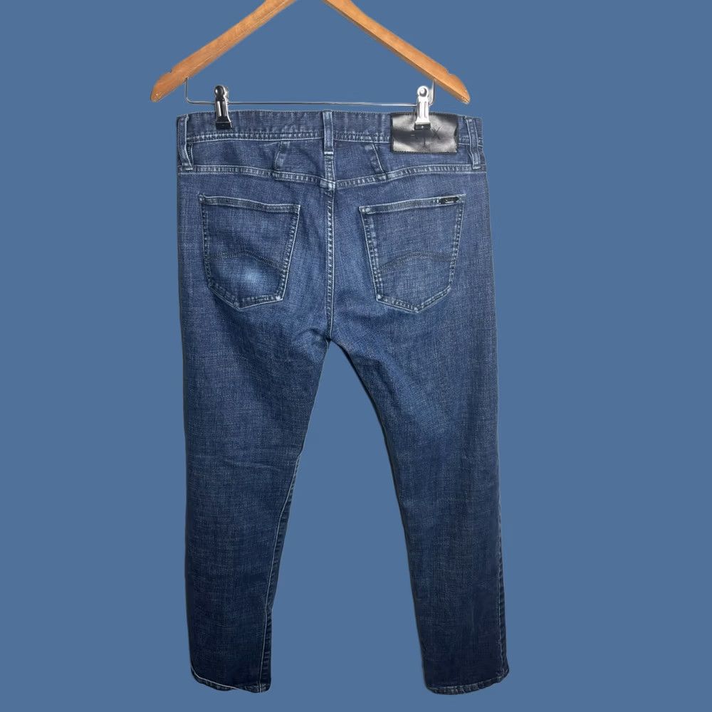 Armani Exchange Armani Exchange Jeans J13 Slim Fit 5-Pocket Denim Indigo Blue Size 34 4126 Adult Men Slim Fit Jeans Blue City Logo USA 8NZJ13Z1SAZ55AA Size US 33 - 1 Thumbnail