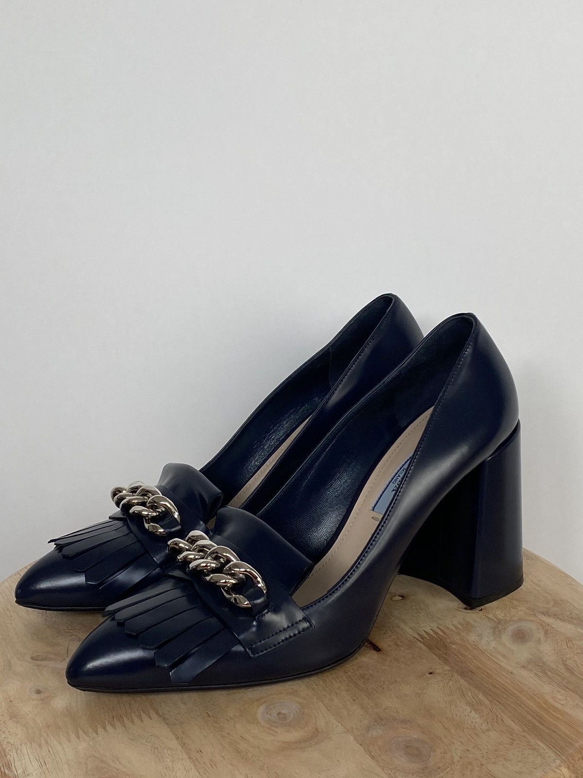 Leather chain loafers by prada hotsell