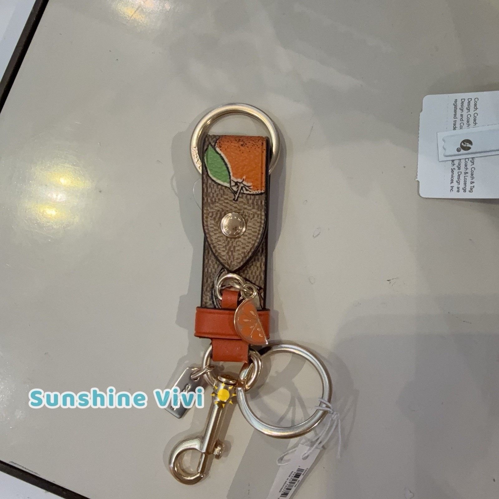 Coach NWT COACH Trigger Snap Bag Charm Orange CAO46 Tan Multi Size ONE SIZE - 1 Thumbnail