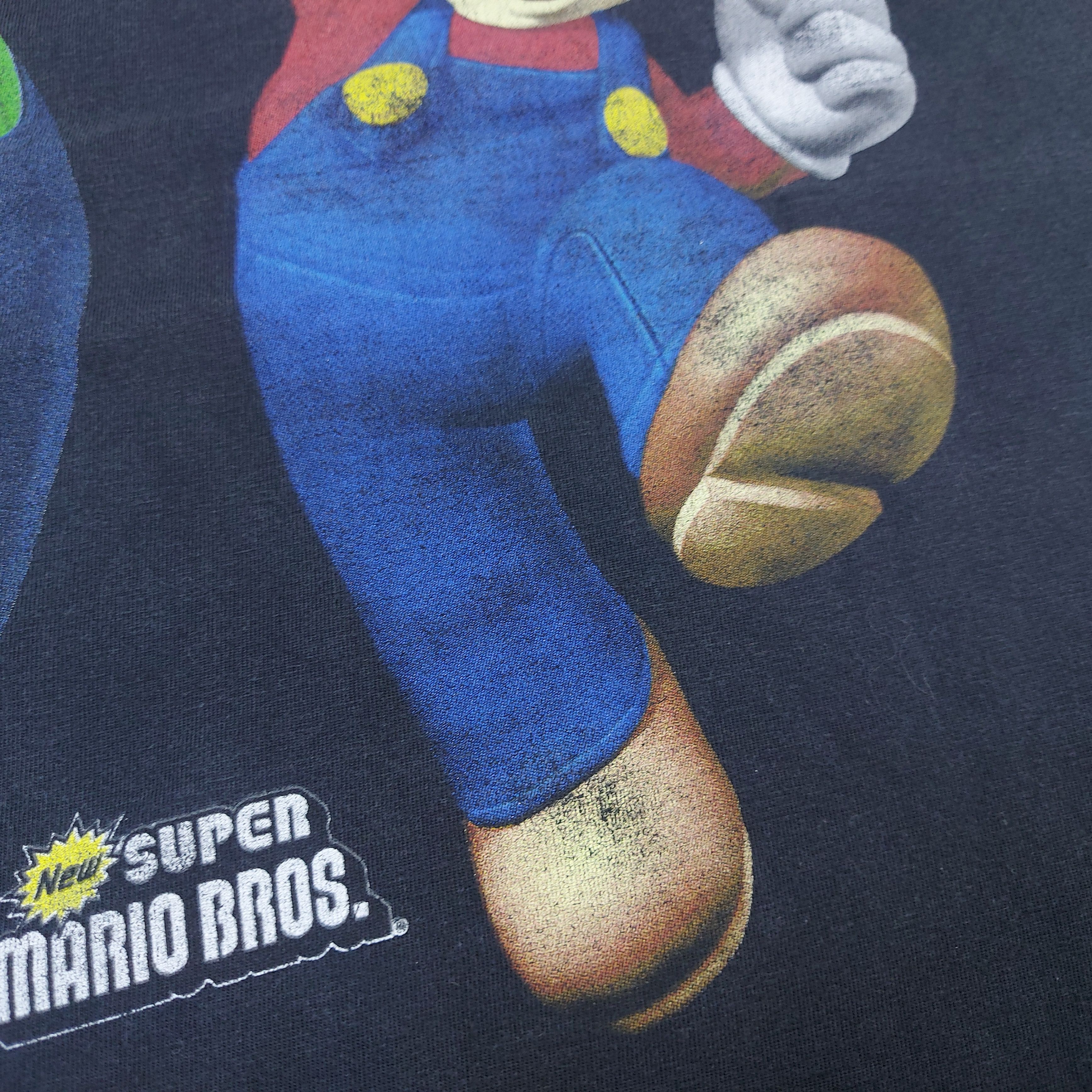 Nintendo Vintage 2006 Nintendo DS New Super Mario Bros Game Promo TEE Size US L / EU 52-54 / 3 - 6 Thumbnail