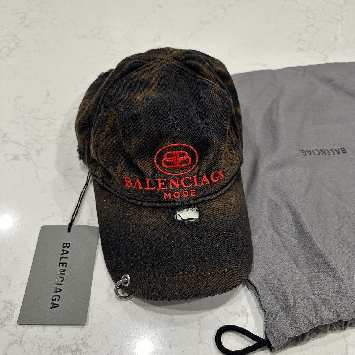 Balenciaga BB MODE DESTROYED PIERCING CAP | Grailed