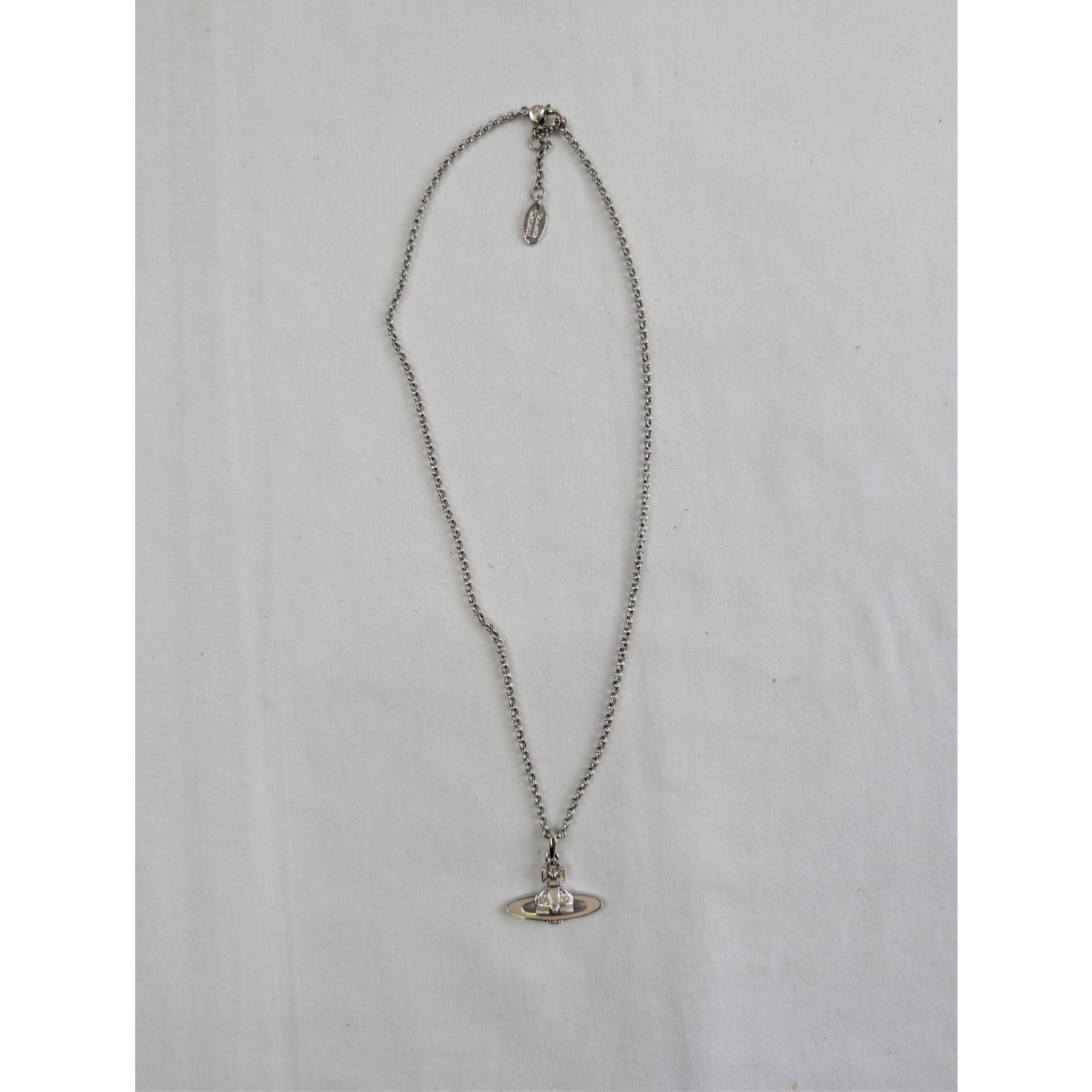 o1rshd1 unisex Neil Mini Bas Relief Pendant Necklace Brass