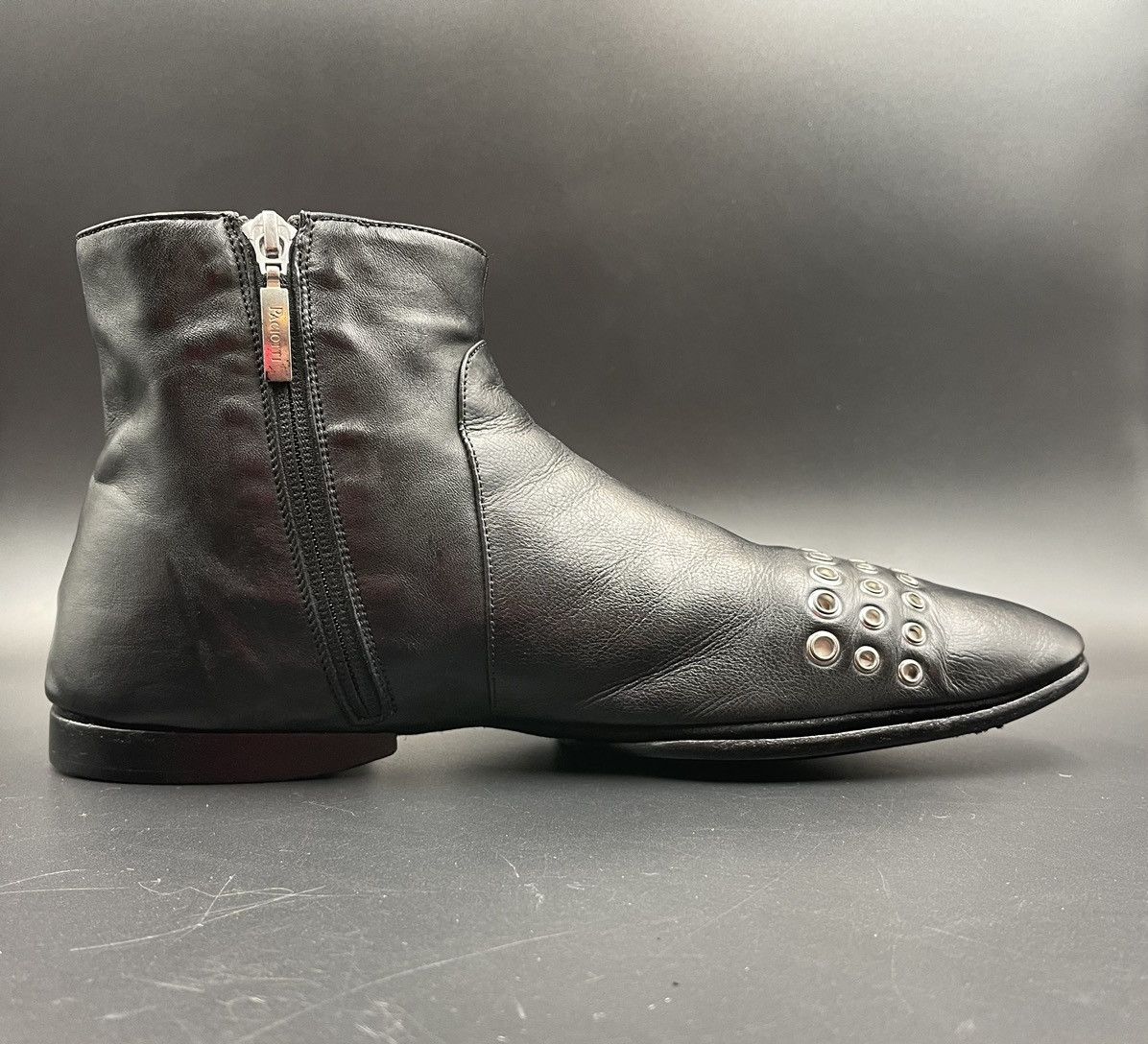 Cesare Paciotti Cesar Paciotti black ankle boots with grommet details. Grailed
