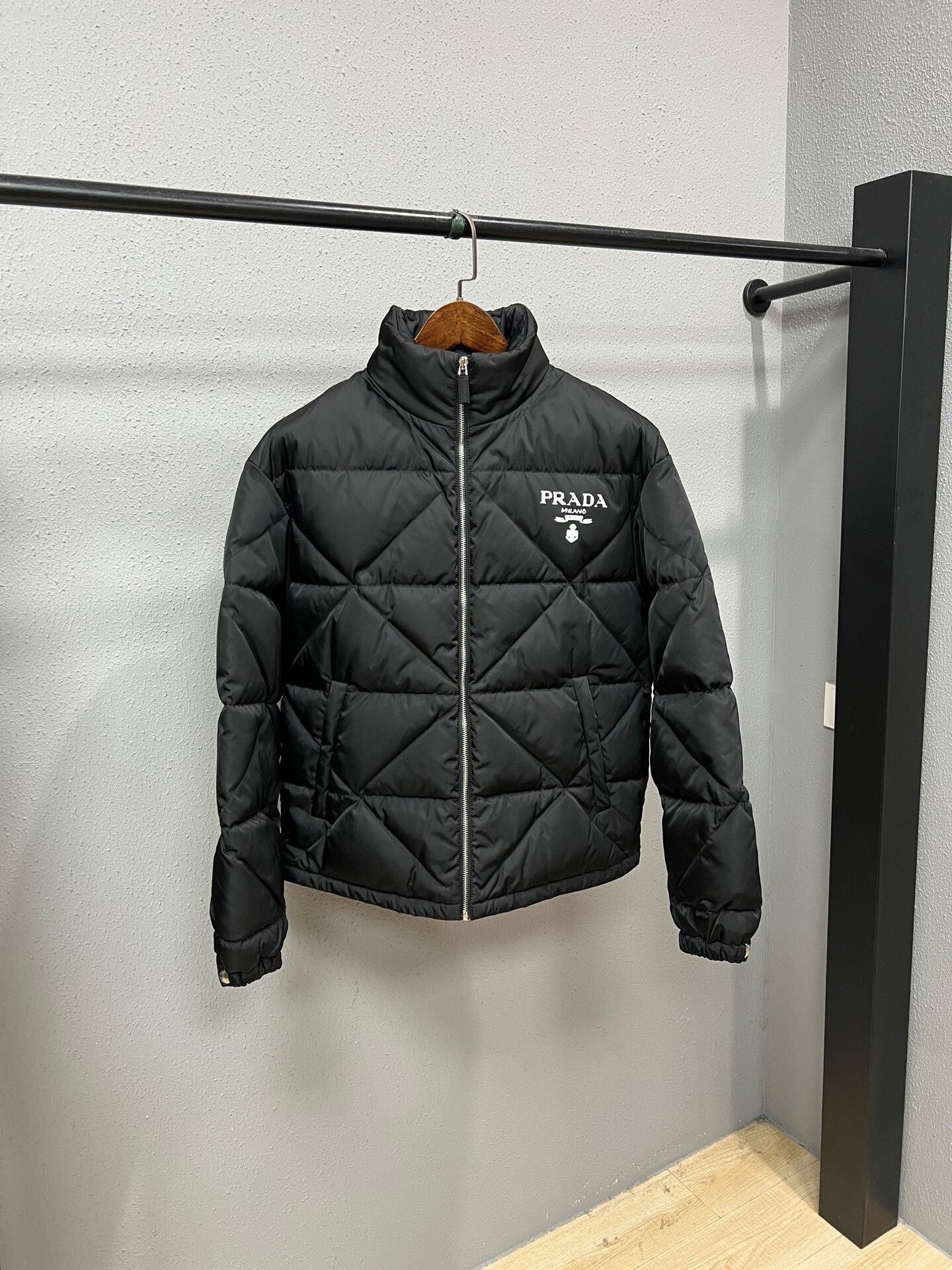 black quilted down jacket by Prada