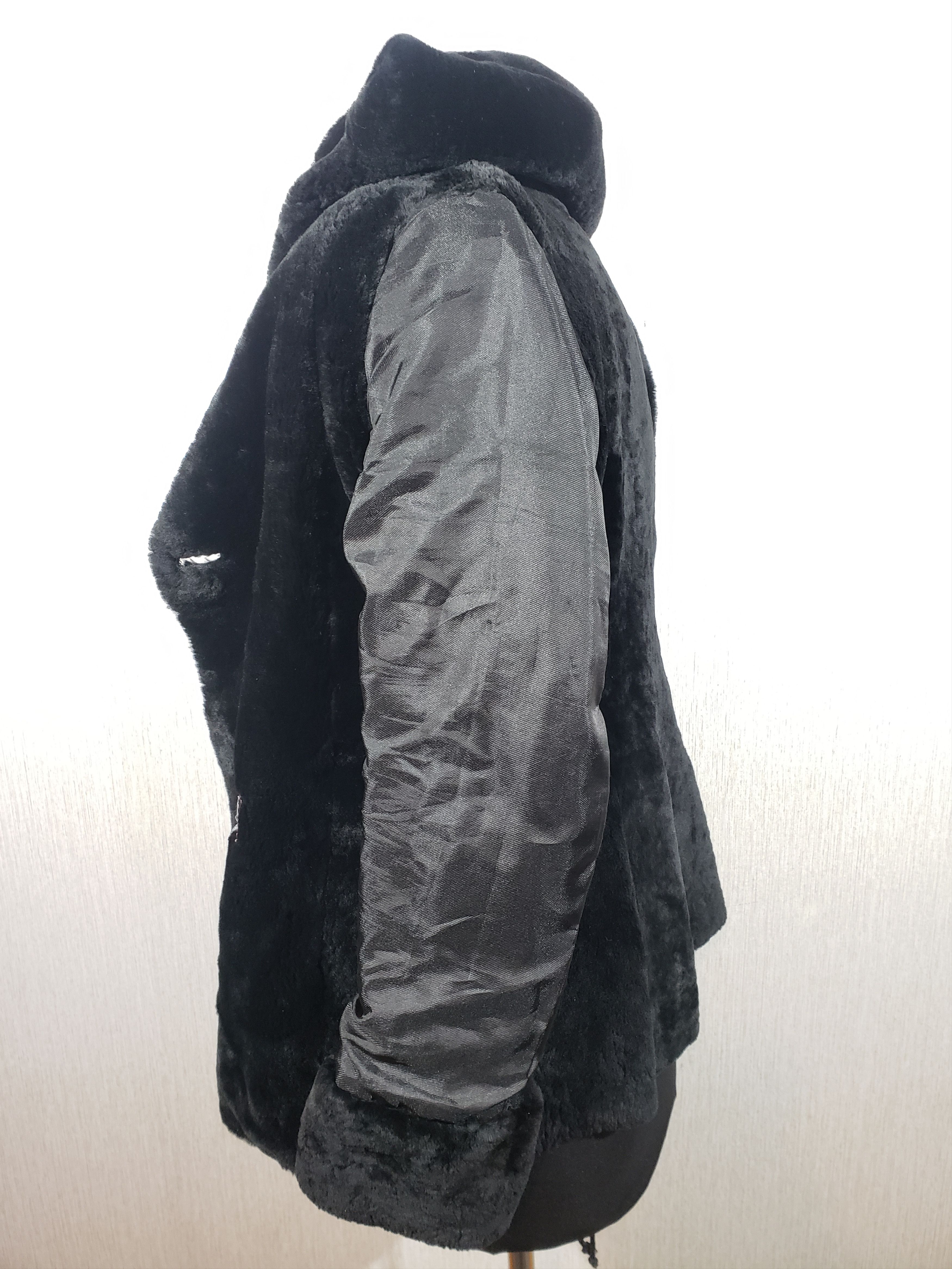 Stylish women's red sheepskin coat with a hood. Fur Faux Fur