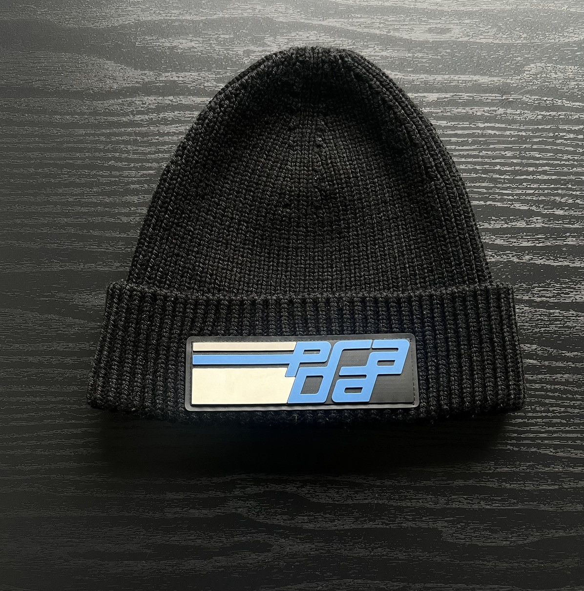 image of Prada Aw18 Wool Beanie W/ Rubber Logo Patch Firm in Black/Blue, Men's