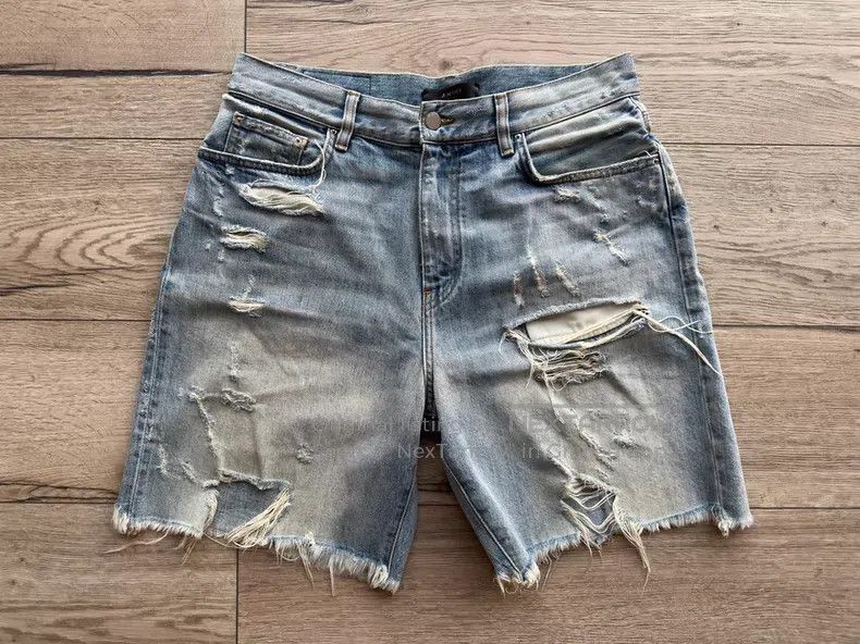 Amiri Amiri Heavy water-washed distressed cut-out denim shorts Size US 32 / EU 48 - 1 Thumbnail