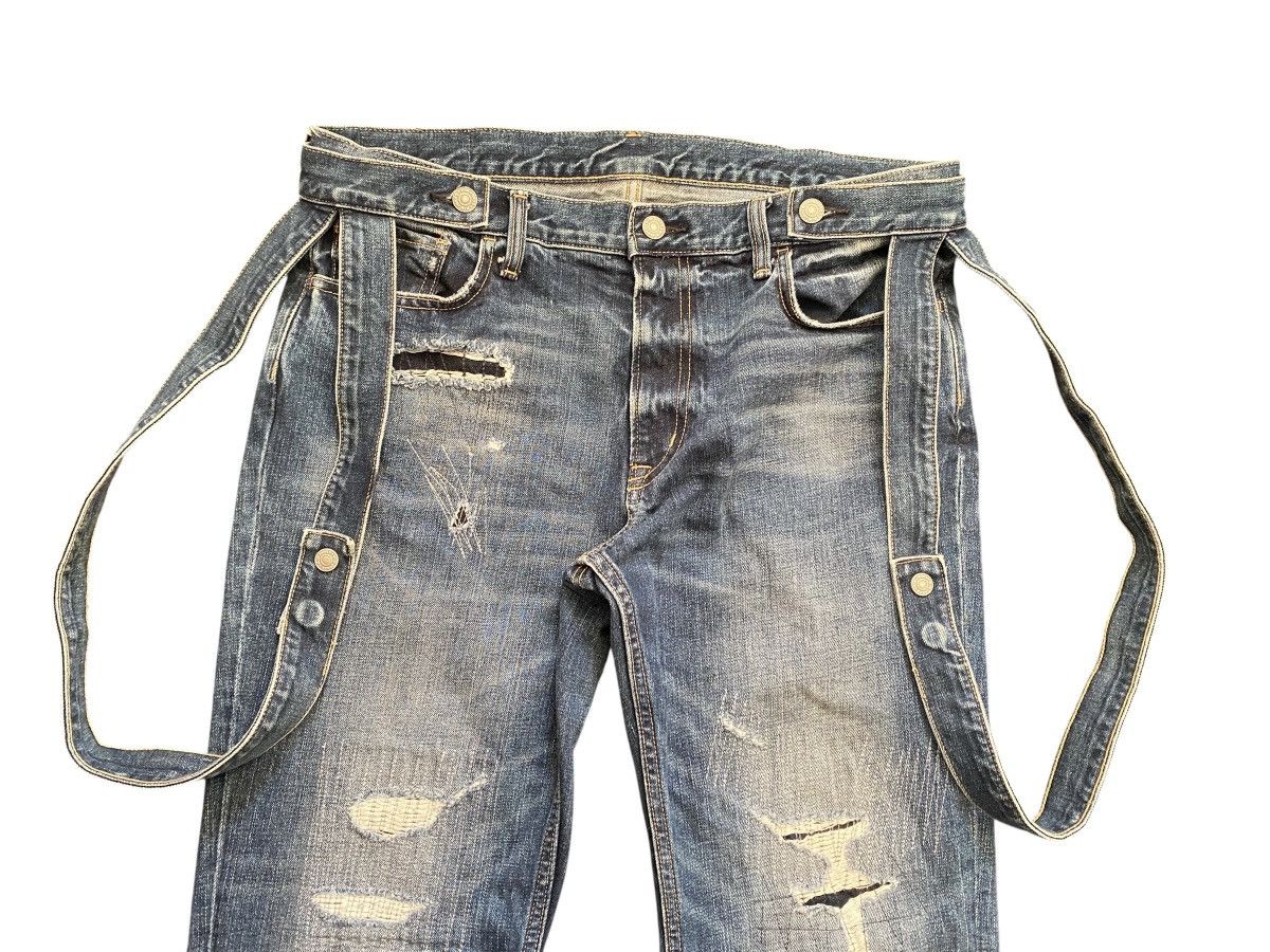 Kim Jones x GU distressed bondage denim