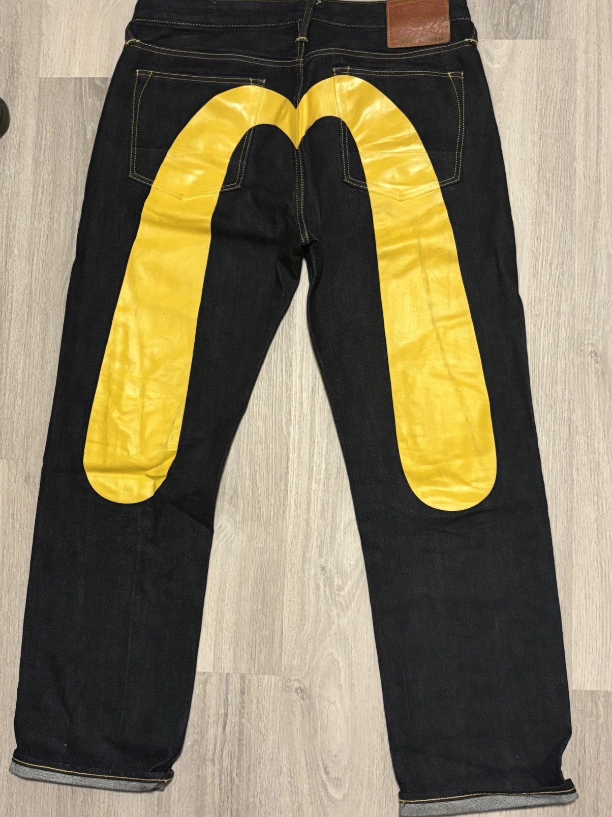 Evisu blue pants with yellow logo