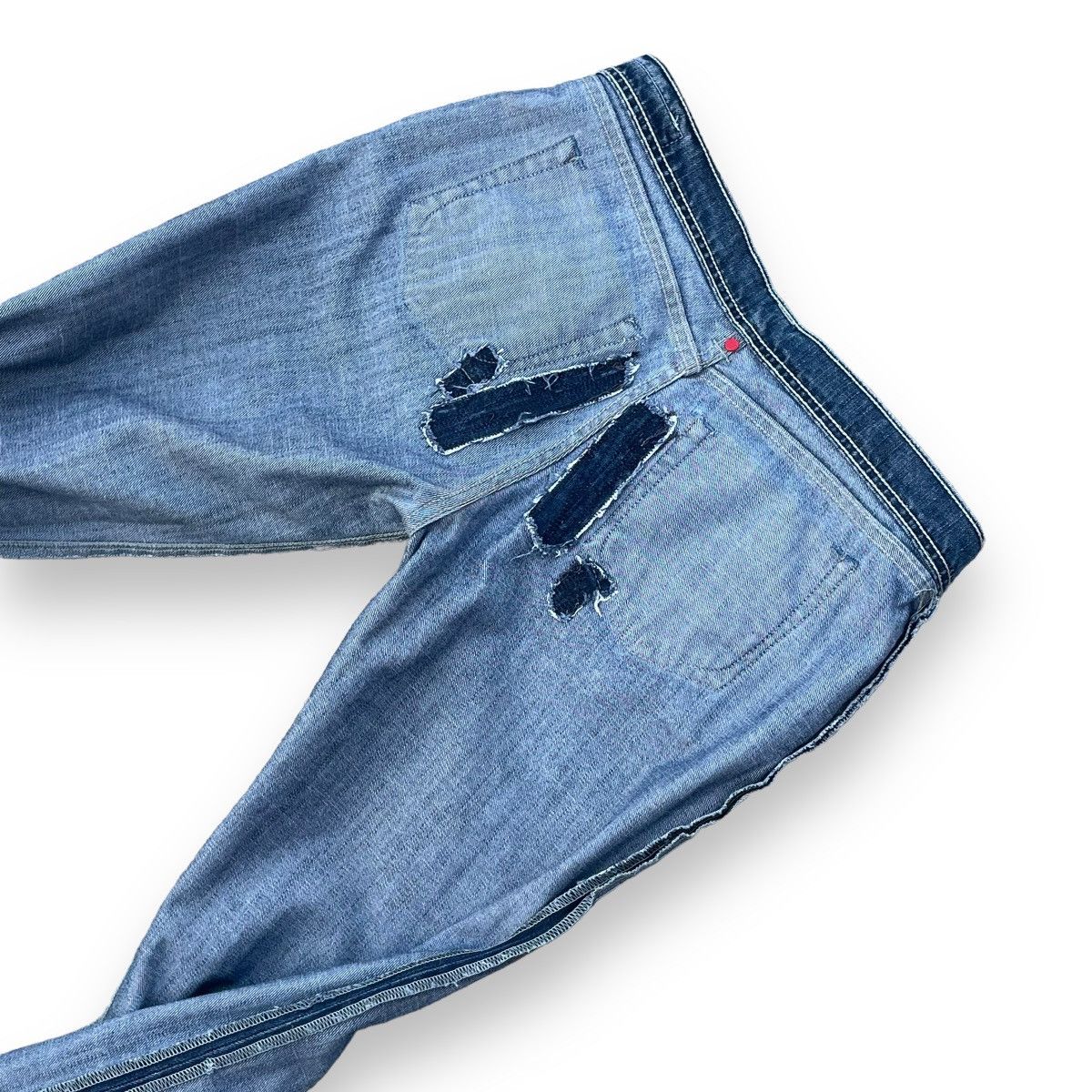 VINTAGE Y2K EVISU X PUMA DISTRESSED WASHED DENIM PANTS